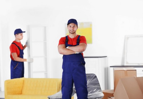 Local movers handling fragile belongings and furniture with care