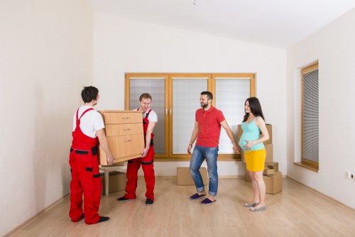 Local moving team handling boxes and furniture for a Locksbottom move