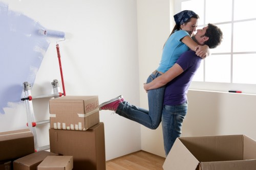 Furniture and boxes being transported by a local moving truck