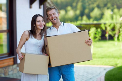 Packed household boxes and furniture ready for a local house move