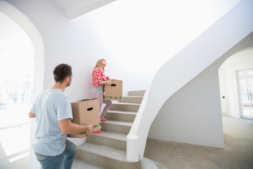 Professional movers loading furniture for a house removal in Locksbottom