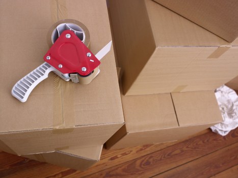 Movers carrying furniture from a family home in Locksbottom